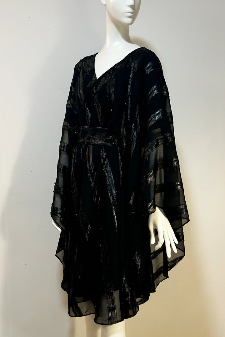 This Lucie black gloss stripe Kaftan is a beautiful, dramatic yet effortless design with a flowing curved chiffon jacquard overlay and an attached black satin slip underneath.