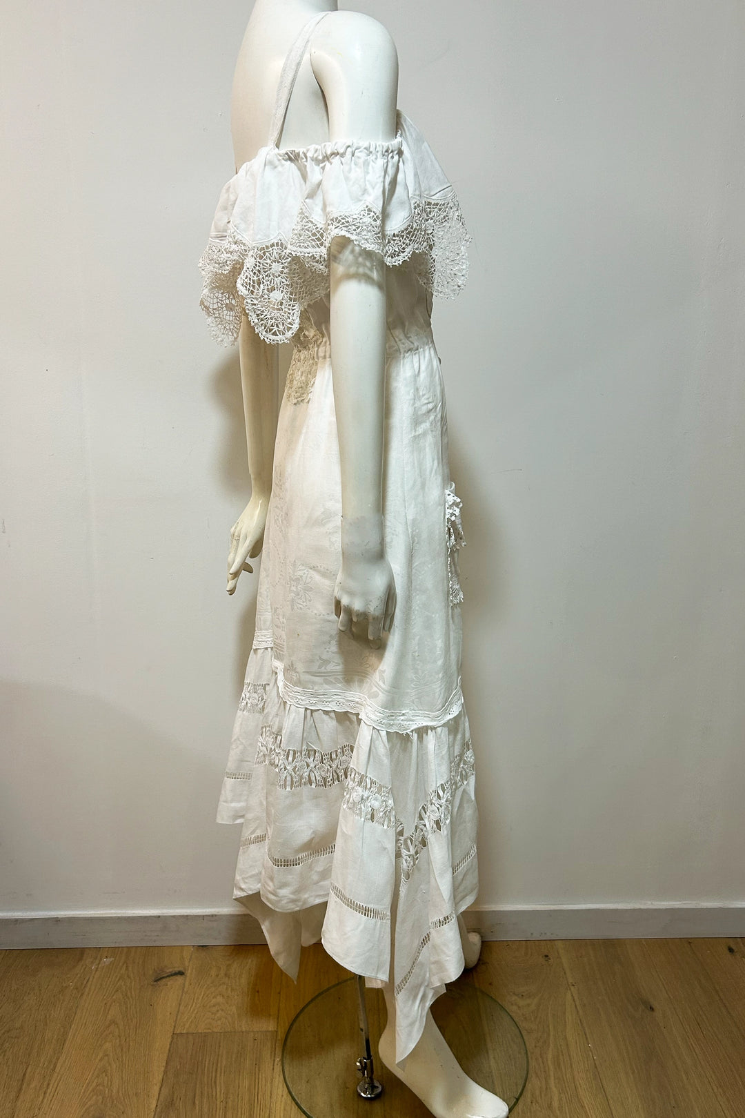 The Pollyanna dress is a one of a kind creation made from antique lace doilies and tablecloths.