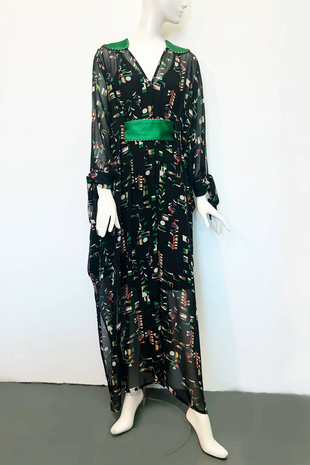A maxi-length black kaftan in sheer fabric with print handmade by Holly Campbell Studio in Edinburgh.
